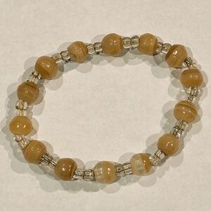 Natural golden colored stone crystal bracelet with elastic rope